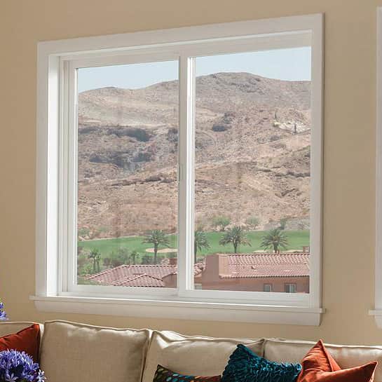 A view of a mountain seen through a sliding window.