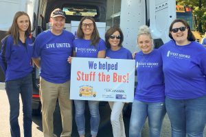 A group of West Shore Home employees participating in United Way's Stuff The Bus campaign.