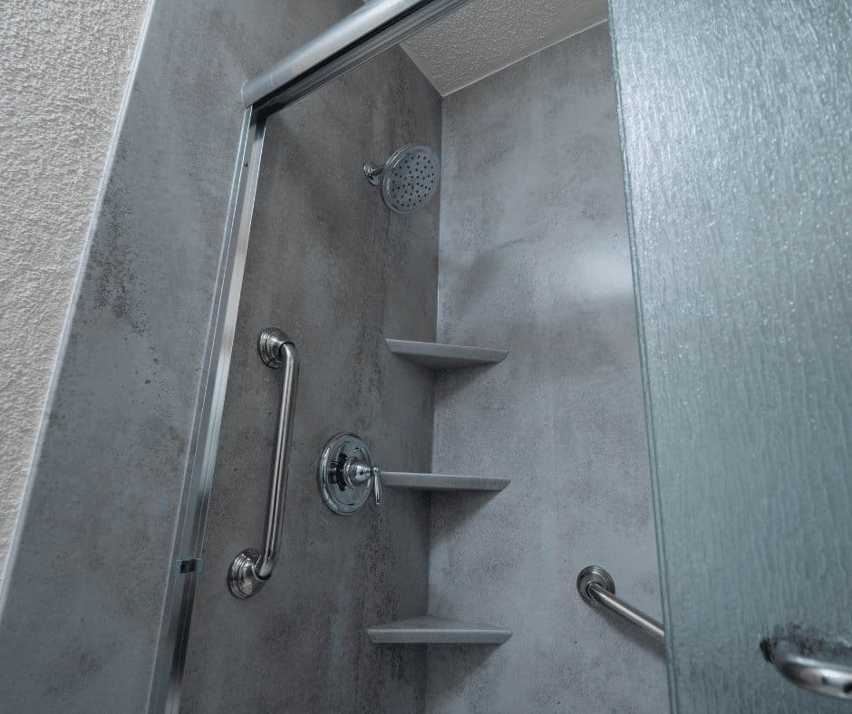 Grey walk in marble acrylic shower.