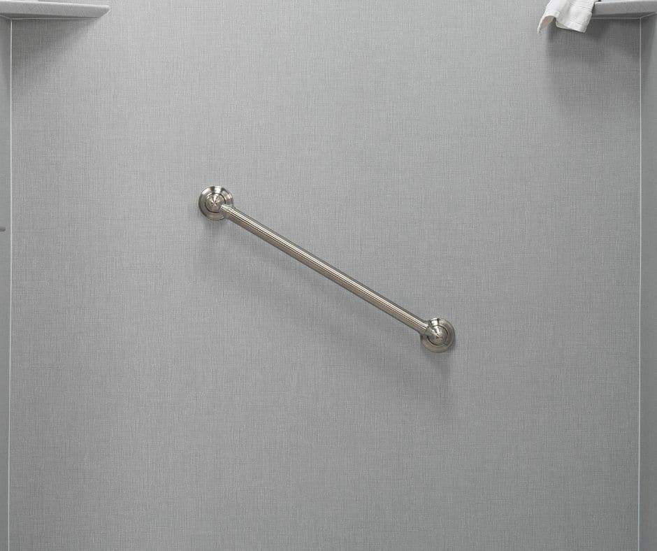 A diagonal silver grab bar on a grey acrylic shower wall.