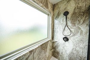 A West Shore Home shower remodel with a large window.