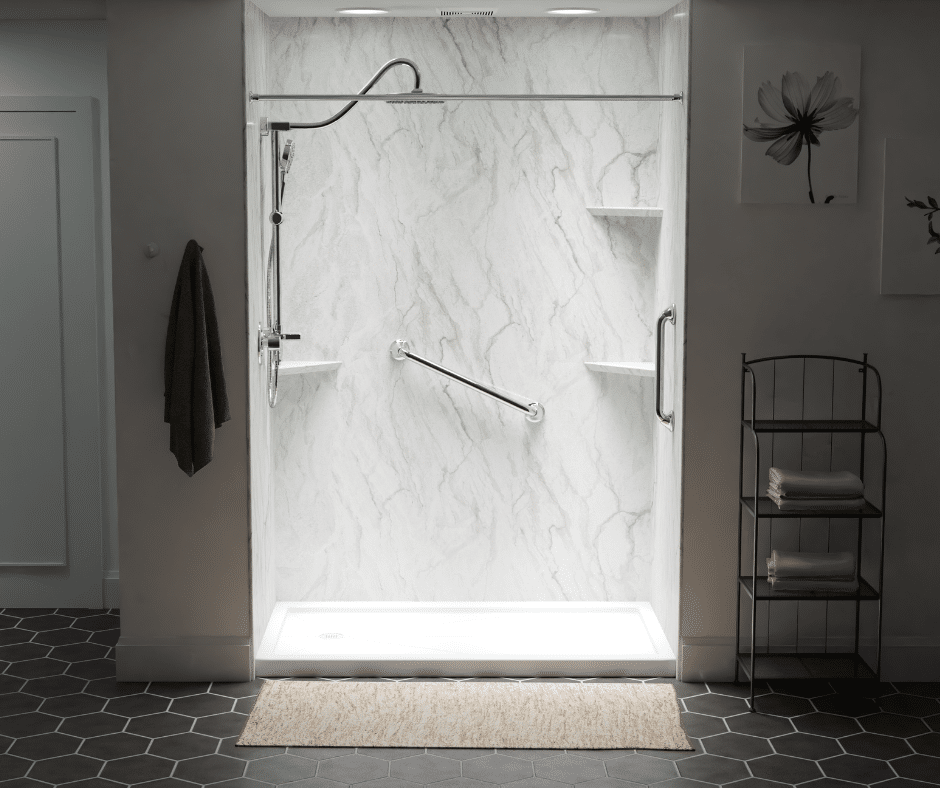 A white marble acrylic walk in shower with chrome fixtures and rainfall shower head.