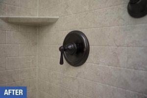 Newly-installed black matte shower hardware.