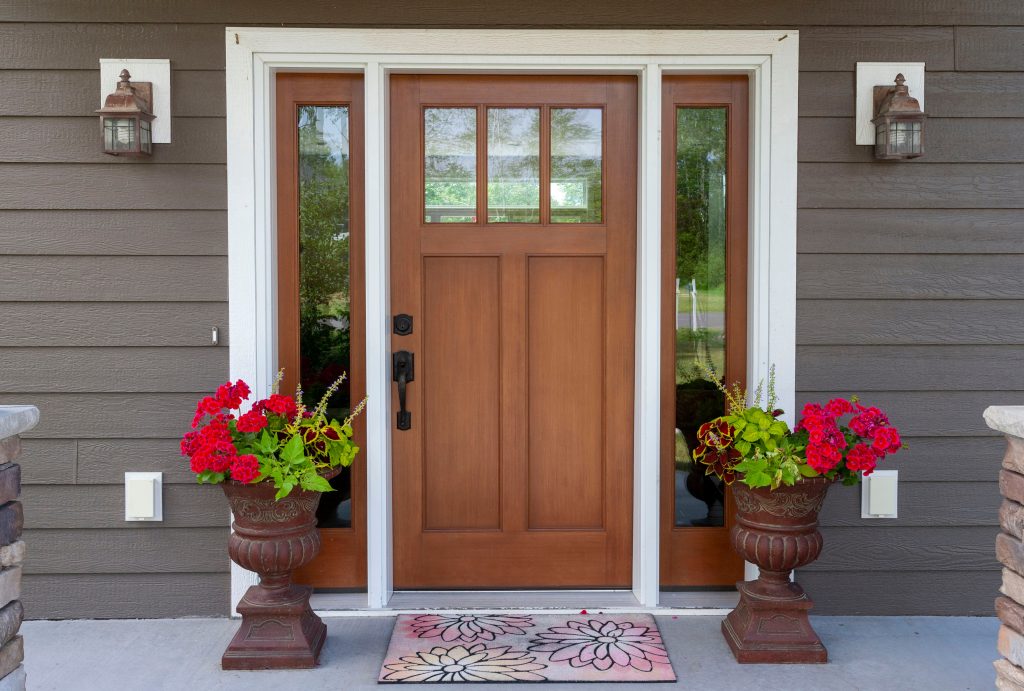 Wooden front door with windows sidelites.